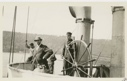 Image of Jack Barnes at wheel of Roosevelt - George Borup in distance